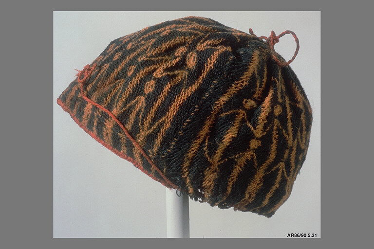A small felt hat laid flat