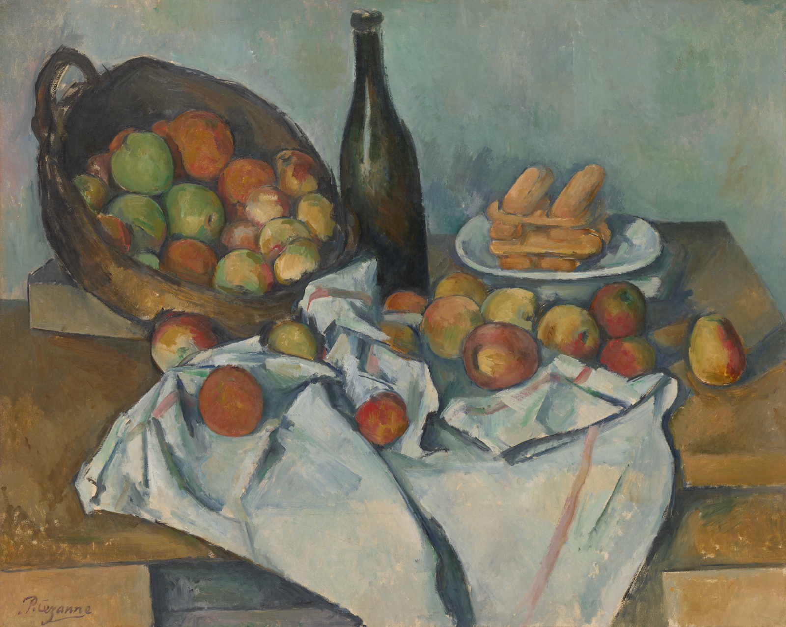A table with a basket of apples spilling onto cloth